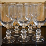 K34. Set of 8 glass goblets. 8.5”h x 4”w - $16